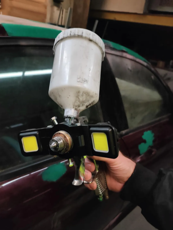 Lamp holder for paint sprayer