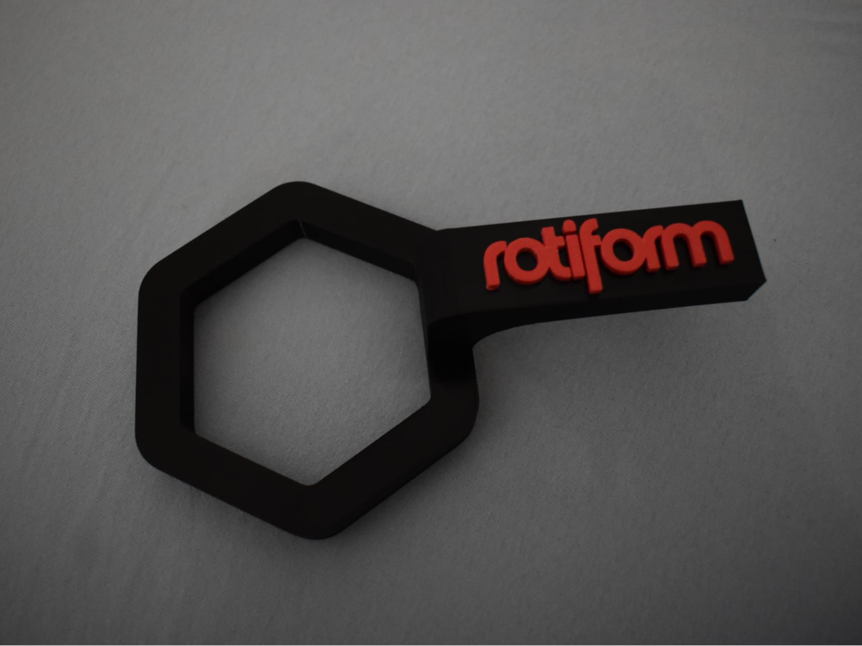 Rotiform wrench for rim cap