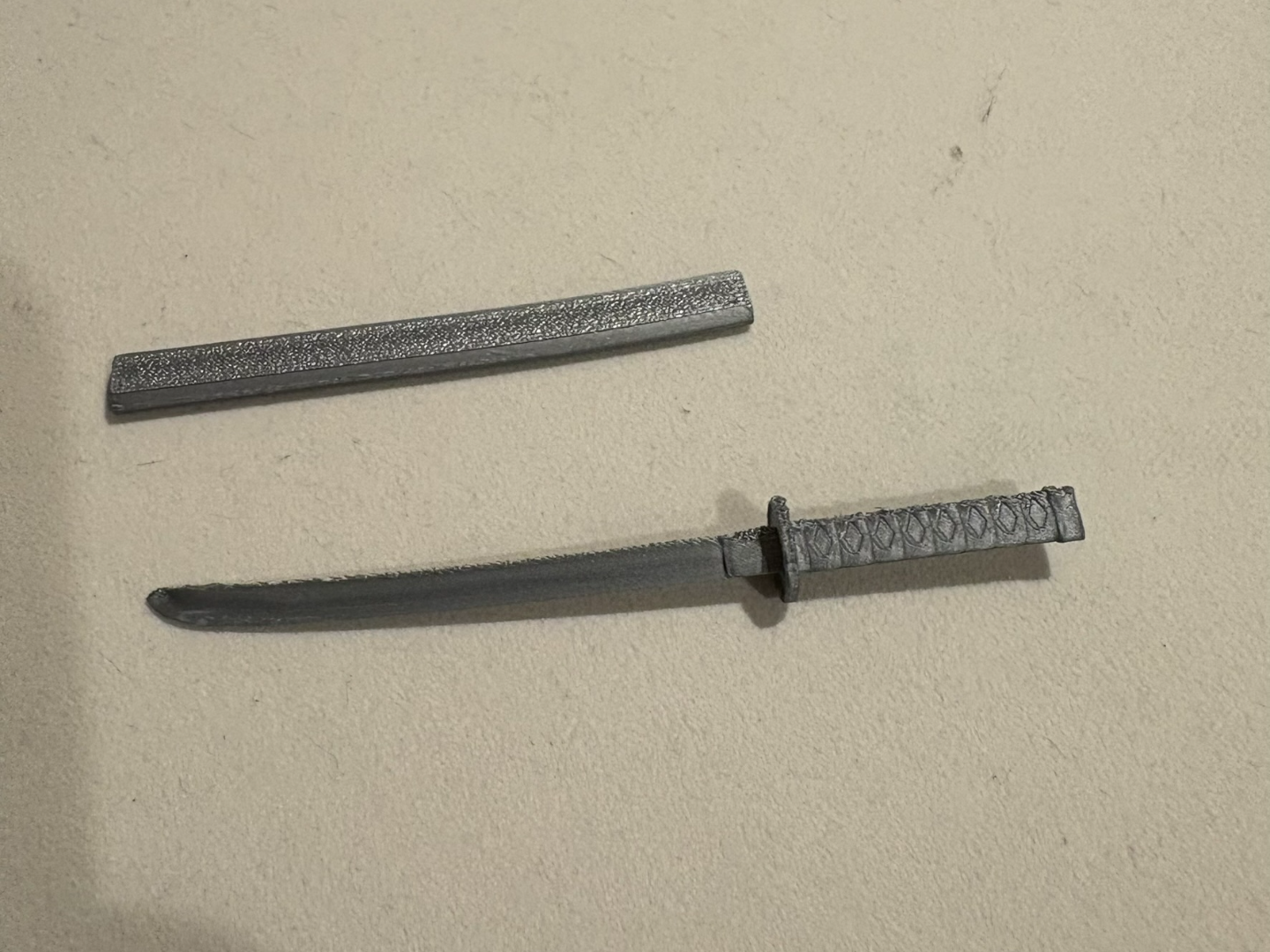 A simply designed mini katana and mini sheath