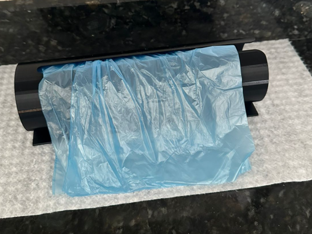 Suporte para rolo de saquinho higiênico