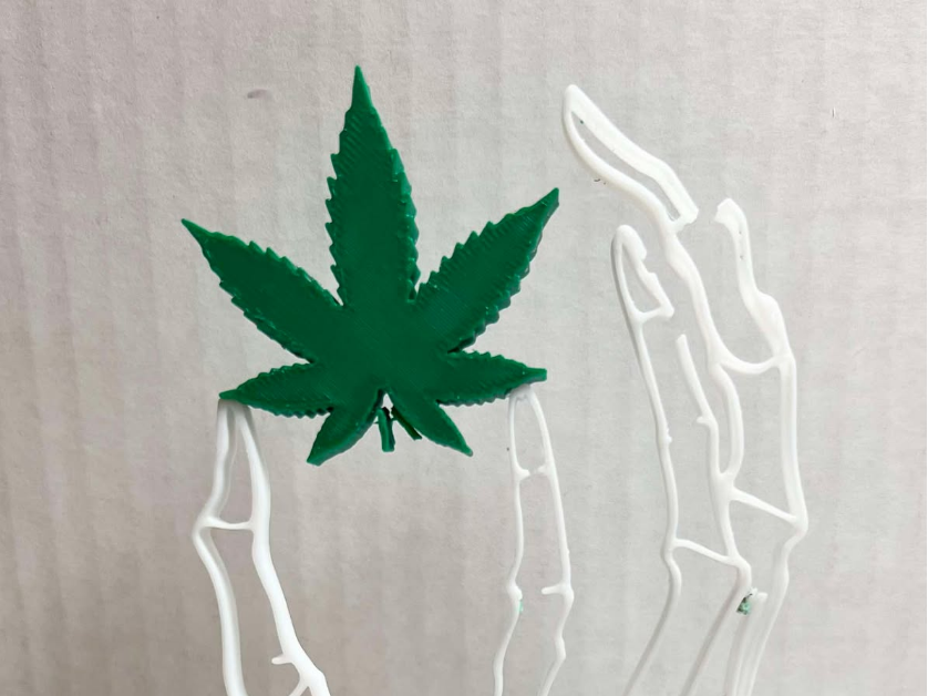 Skeleton Hand Holding A Pot Leaf