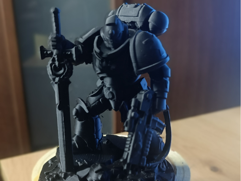 SpaceMarines Sergeant Holding Sword And Bolter