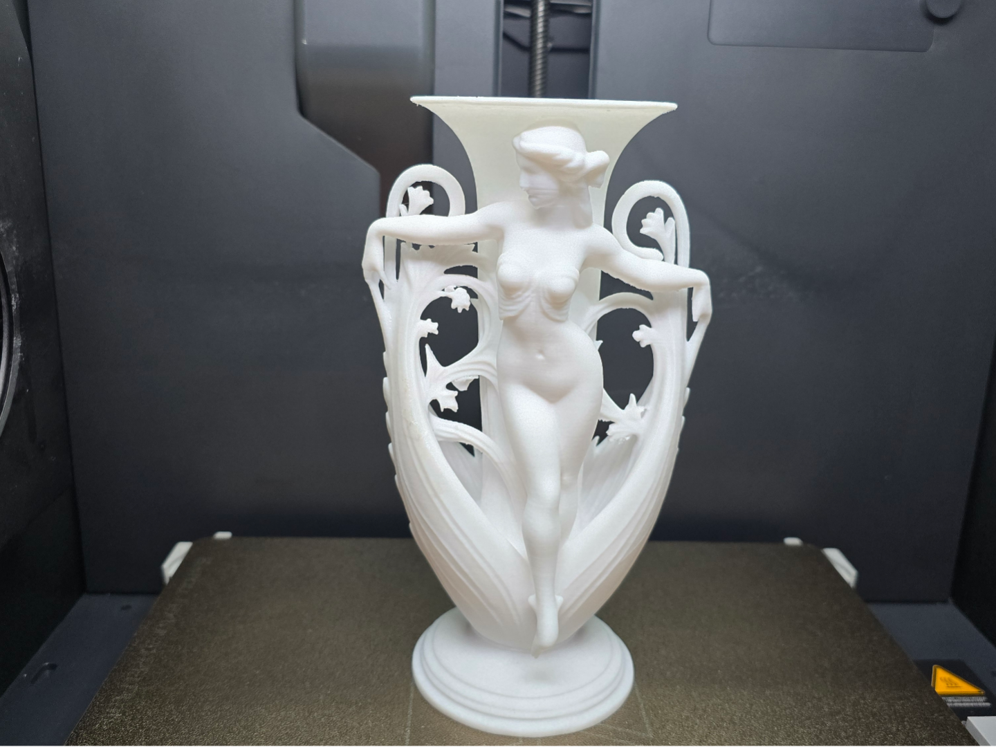 Antique vase with a woman