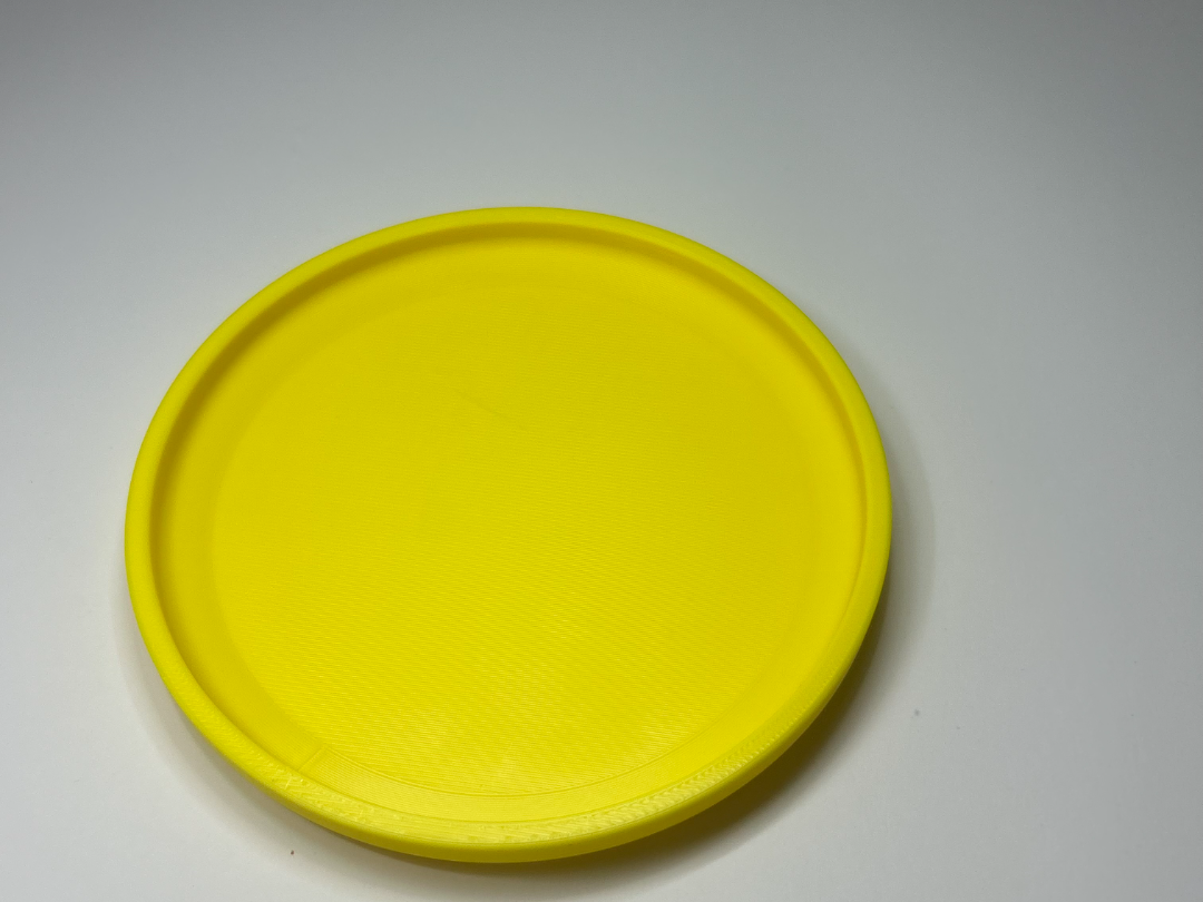 Miniature Frisbee (long range flying disk)