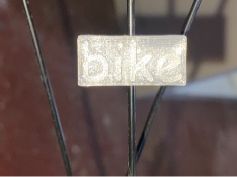 Bike spoke clip Comic Sans