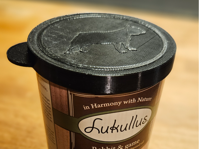 Dog food can lid with french bulldog emblem