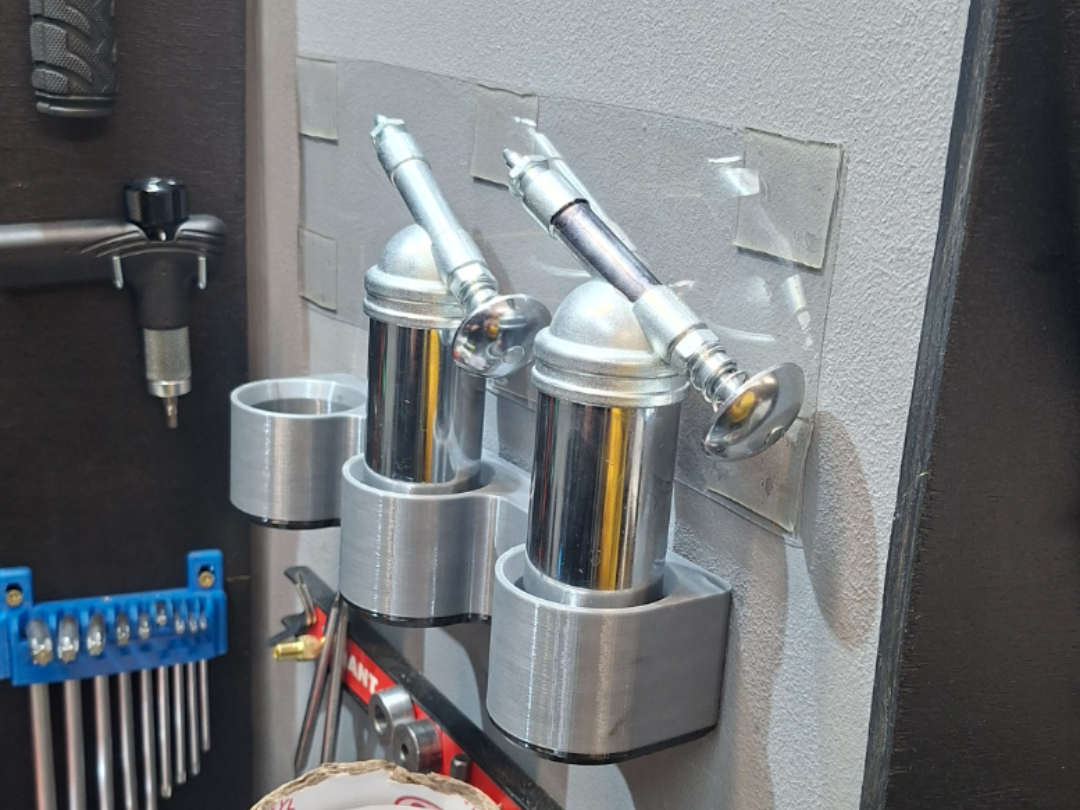 Three Grease gun wall mount