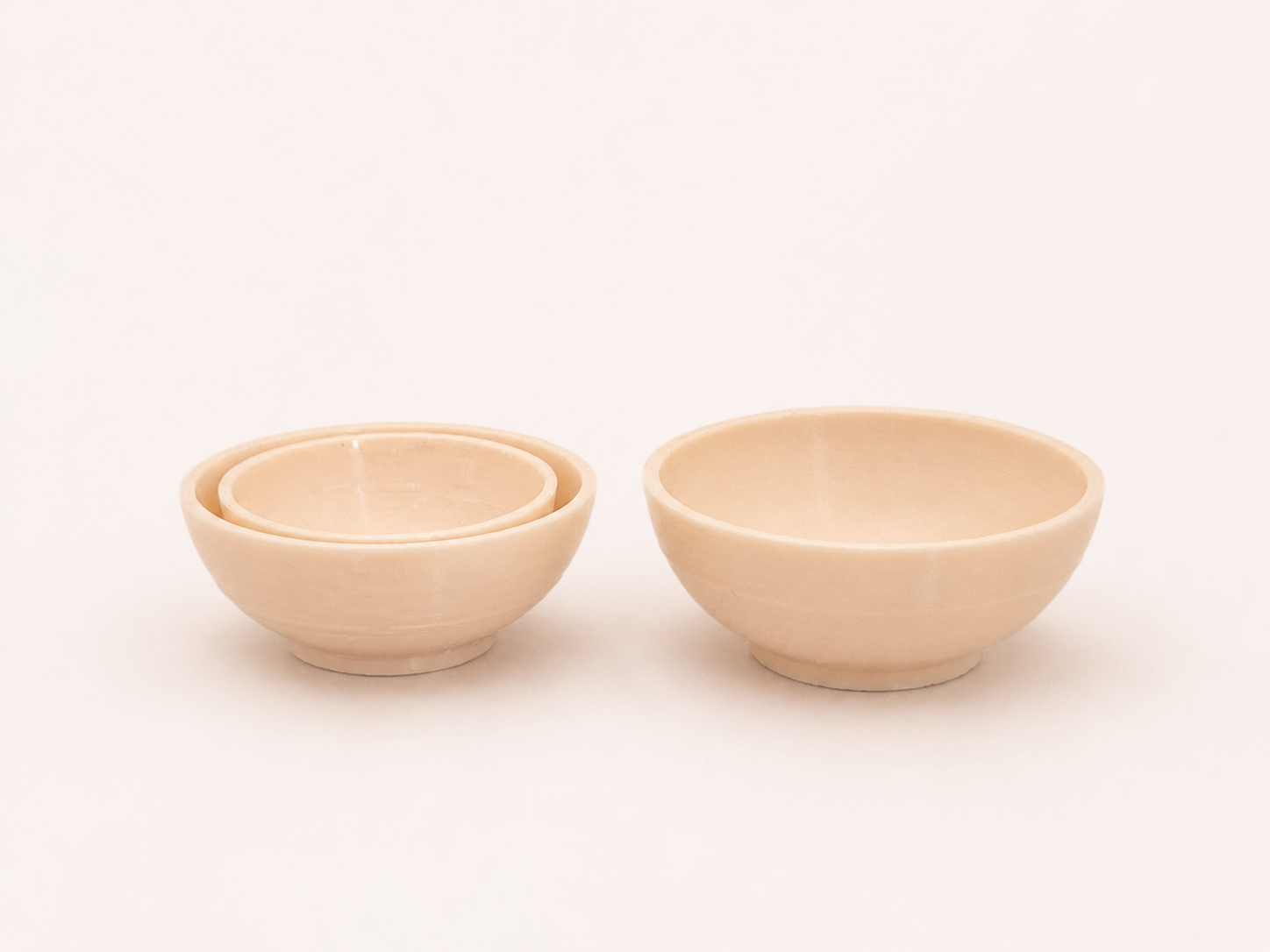 A bowl and tableware suitable for a dollhouse.