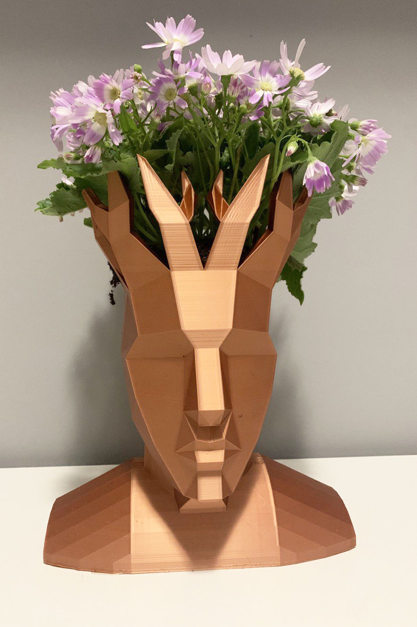 Low poly head flower vase - Embrace modern art with PolyHead, a striking low poly head vase.