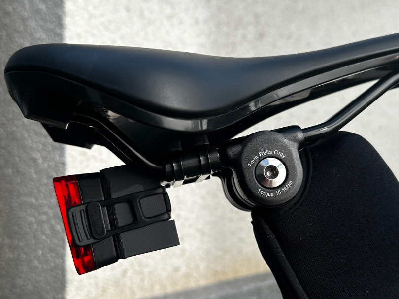 Universal bike light reflector holder at seat