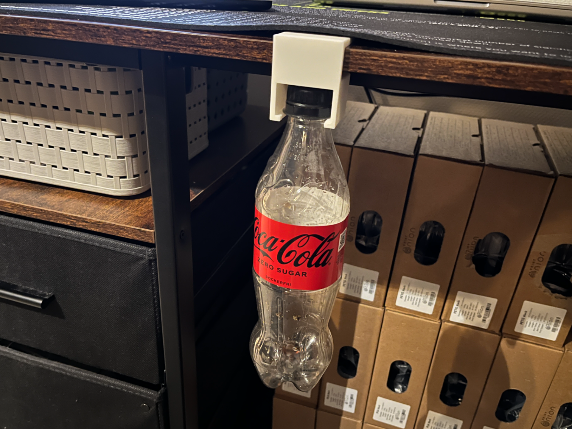 Desk holder for Coca-Cola bottle