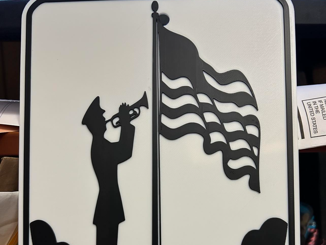 soldier at flagpole