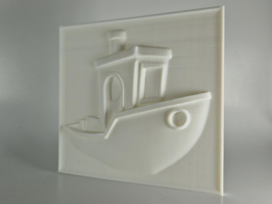 A relief artwork of the iconic Benchy