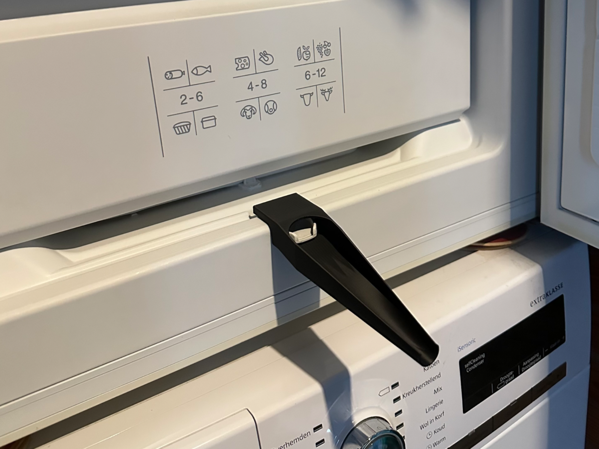 Defrost gutter extender for freezer