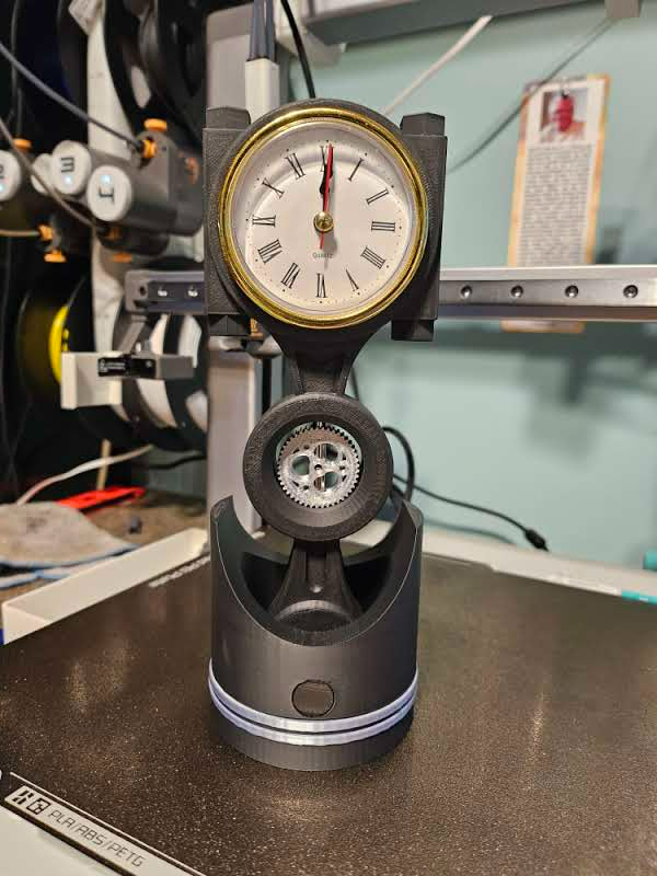 Piston Clock with Swivel Gear