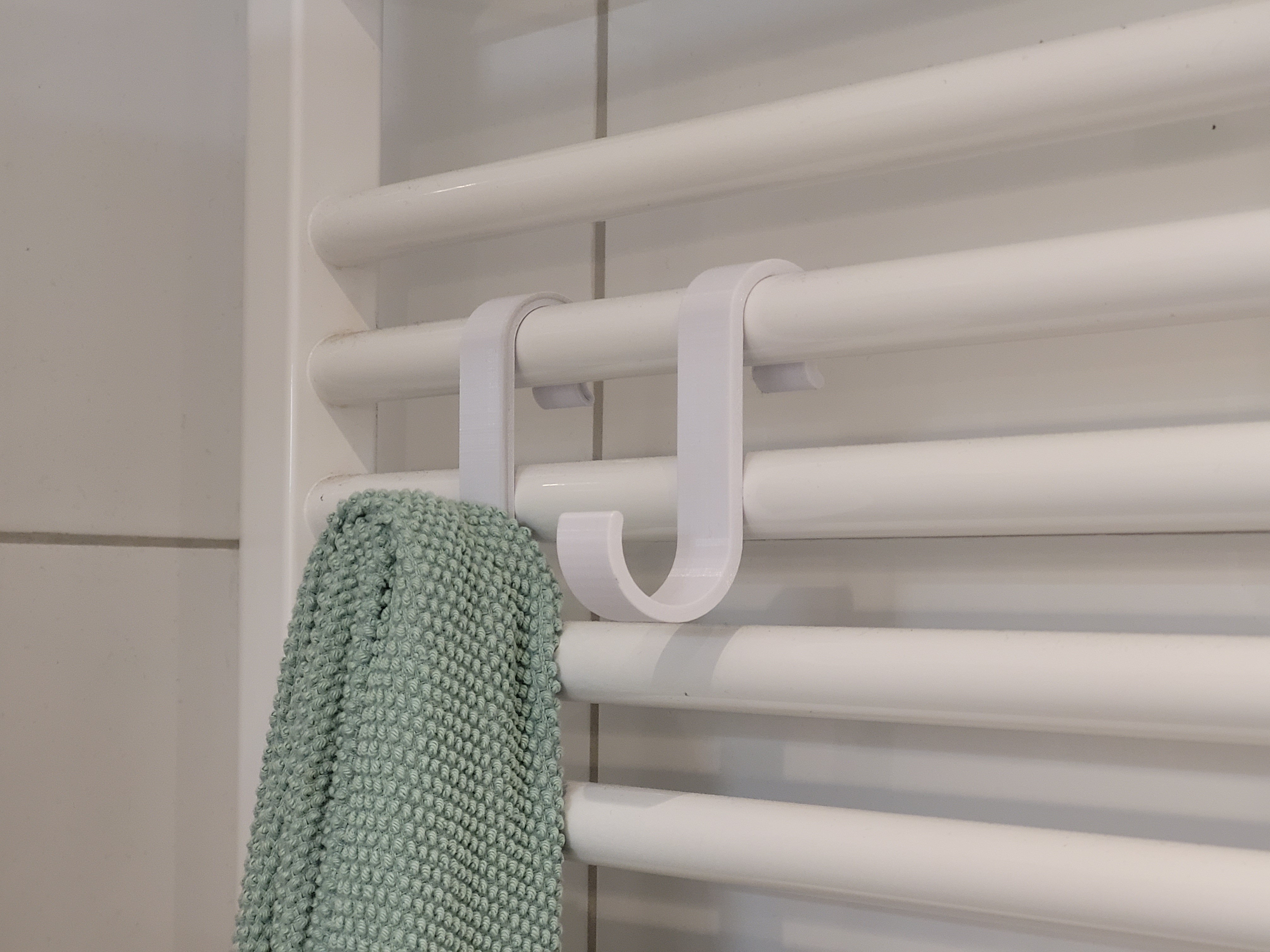 Towel hook for bathroom radiator