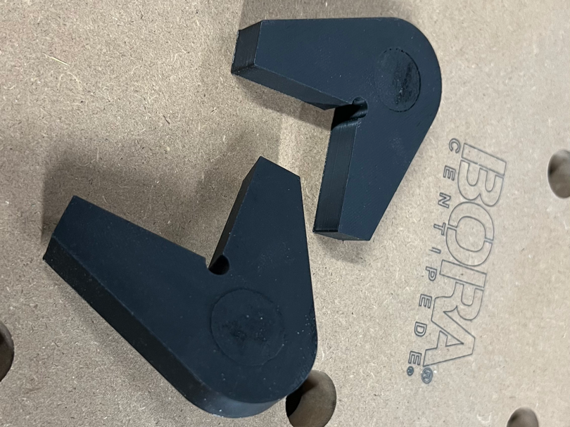 Low profile corner fixture for MFT table dog holes