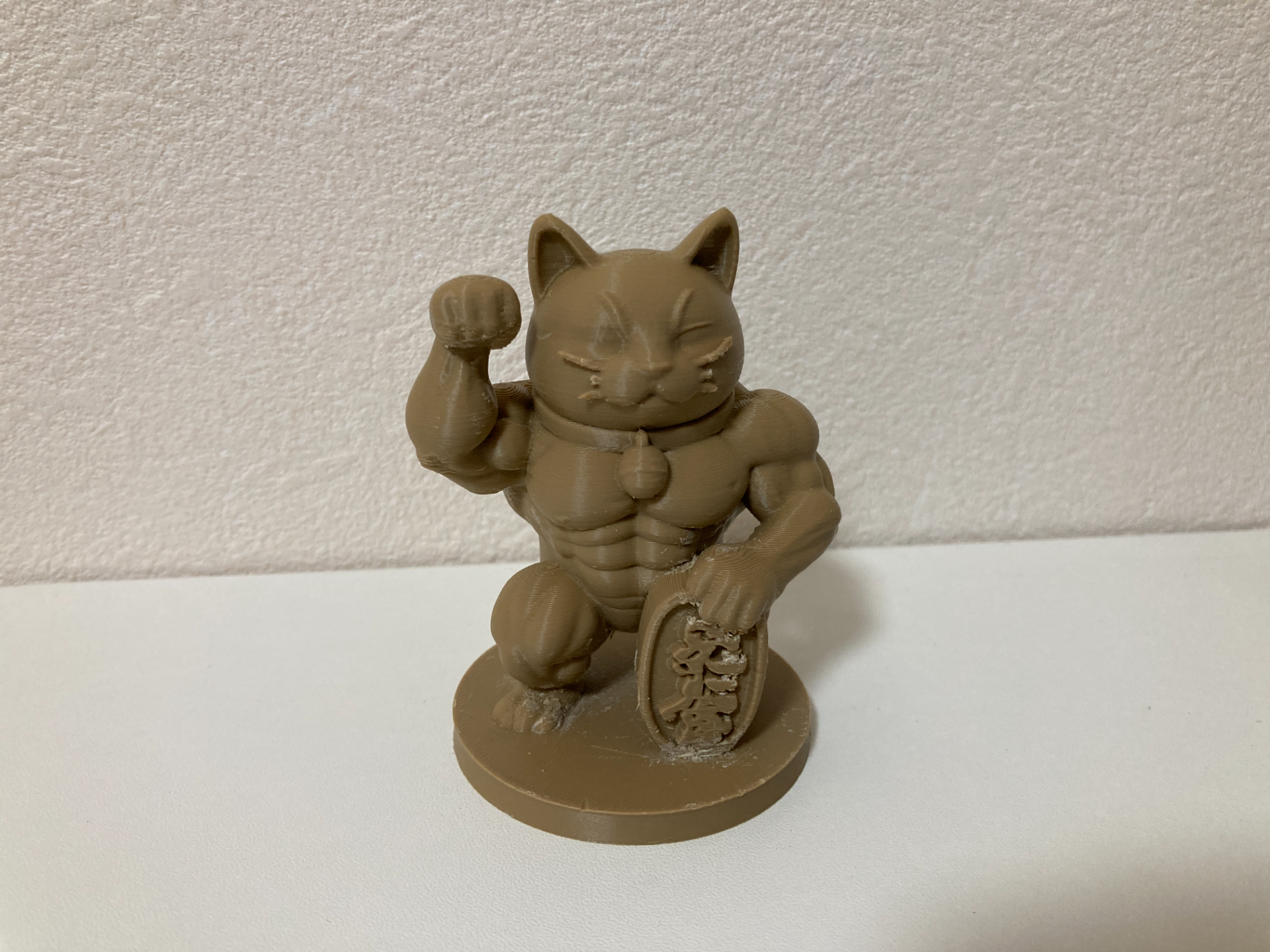 Muscular lucky cat figurine