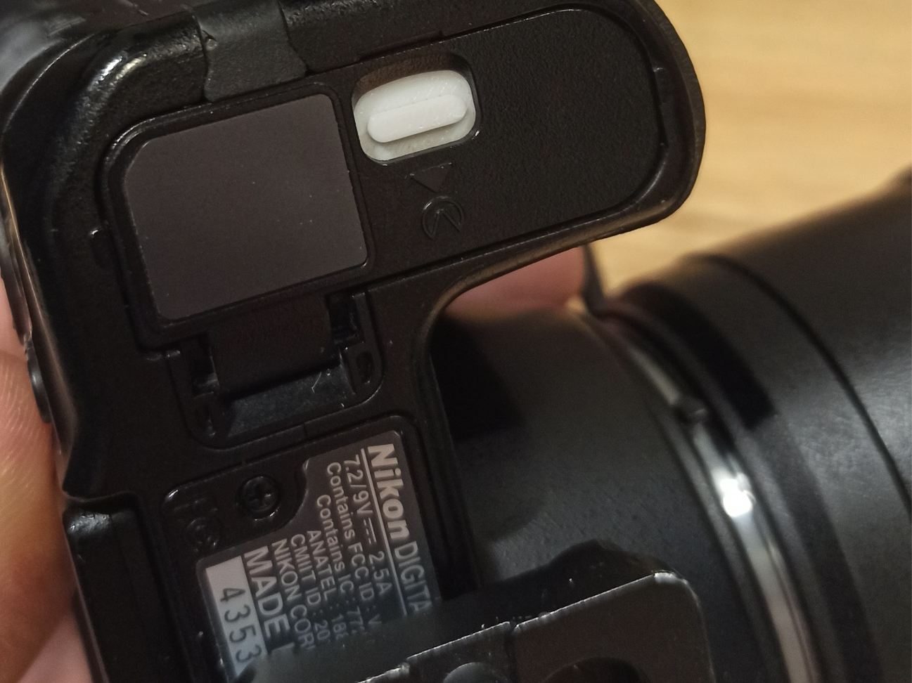 Nikon battery door lock.