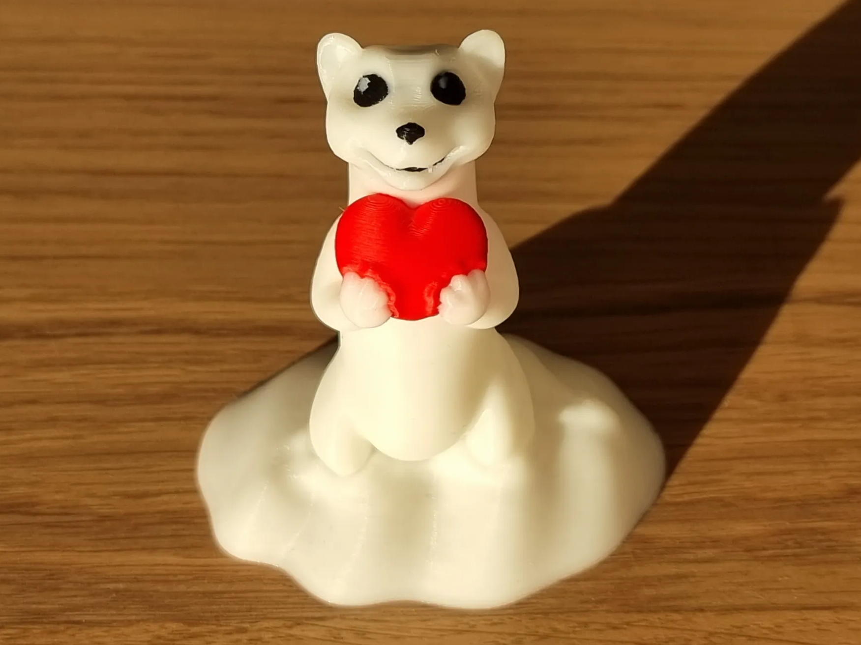 A cute snow Hermelin with Heart for Valentinesday