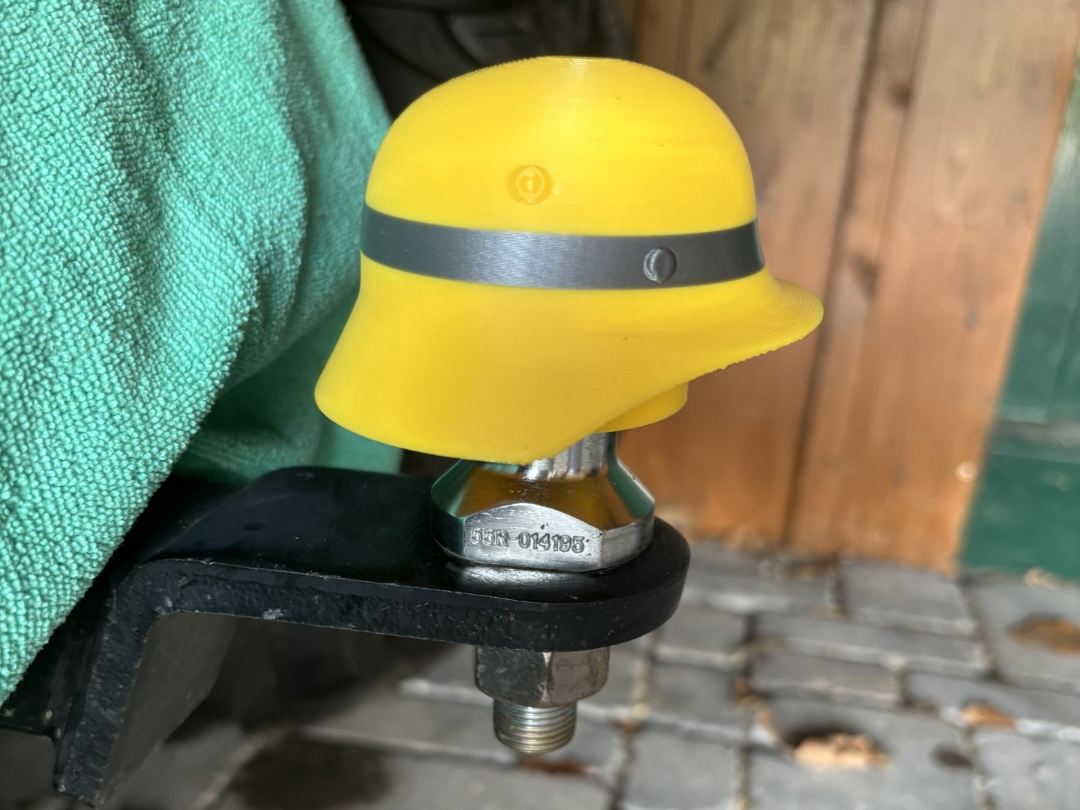 Firefighter helmet trailer hitch