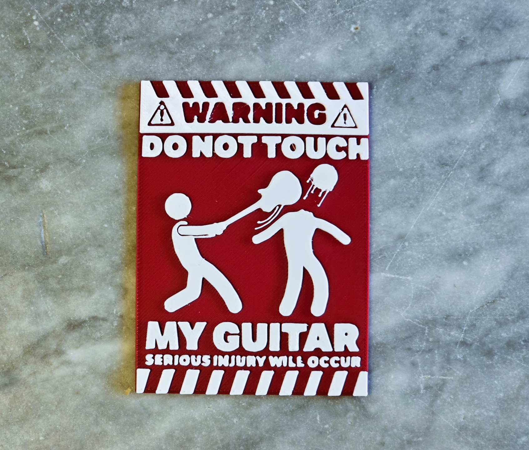 Guitar injury warning sign