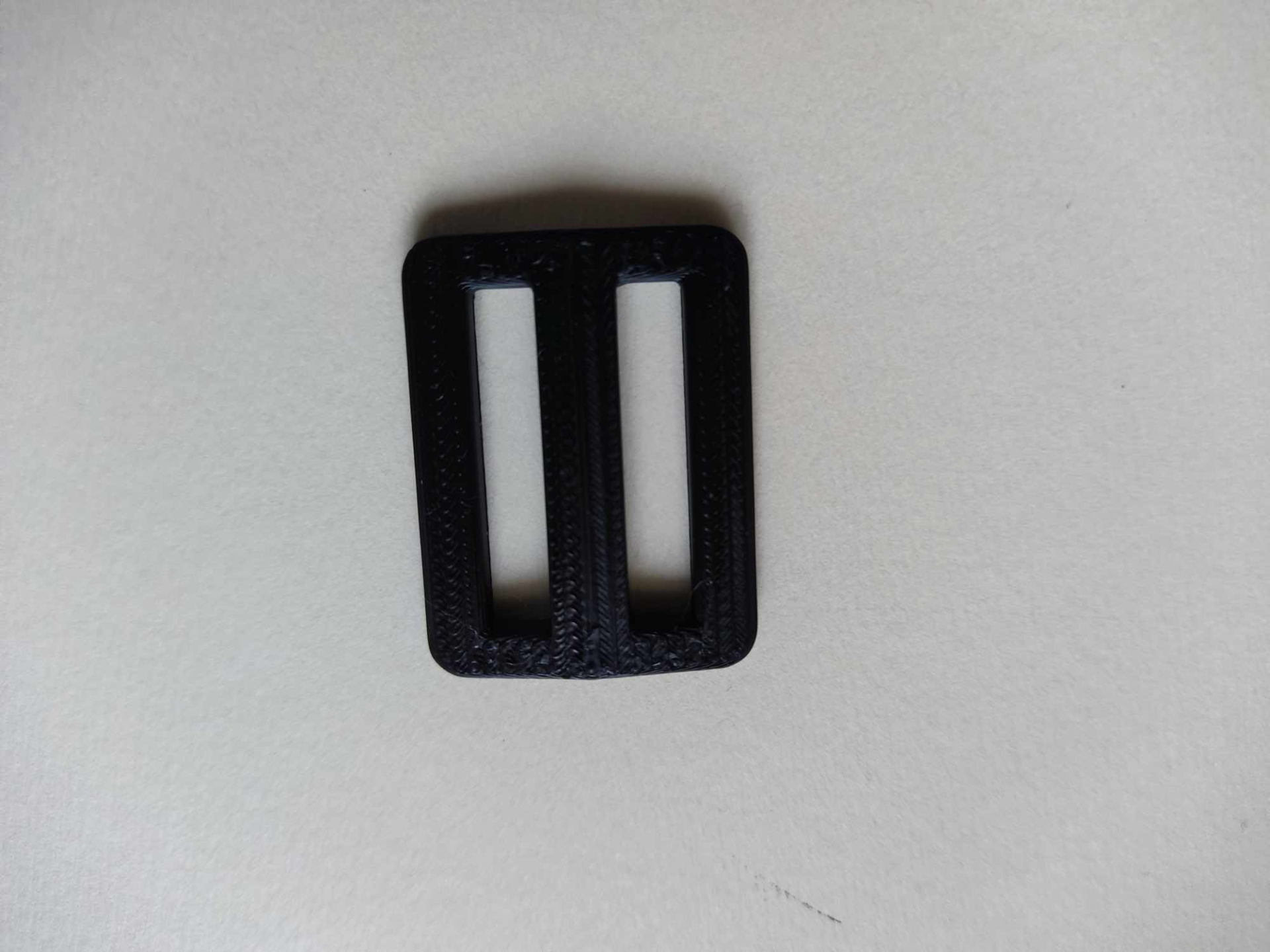 Strap adjuster