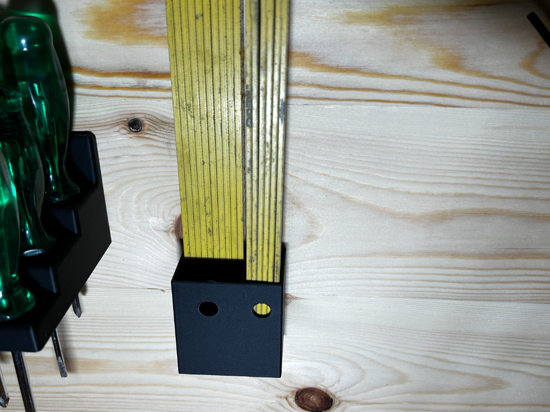 Folding rule wall mount