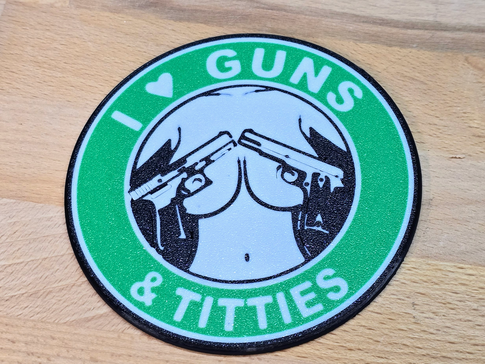 Guns and Titties coaster