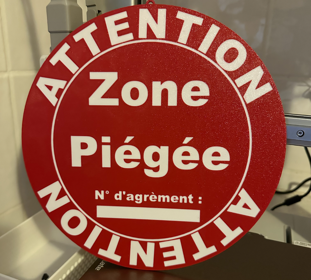 Panneau Attention zone  piégée