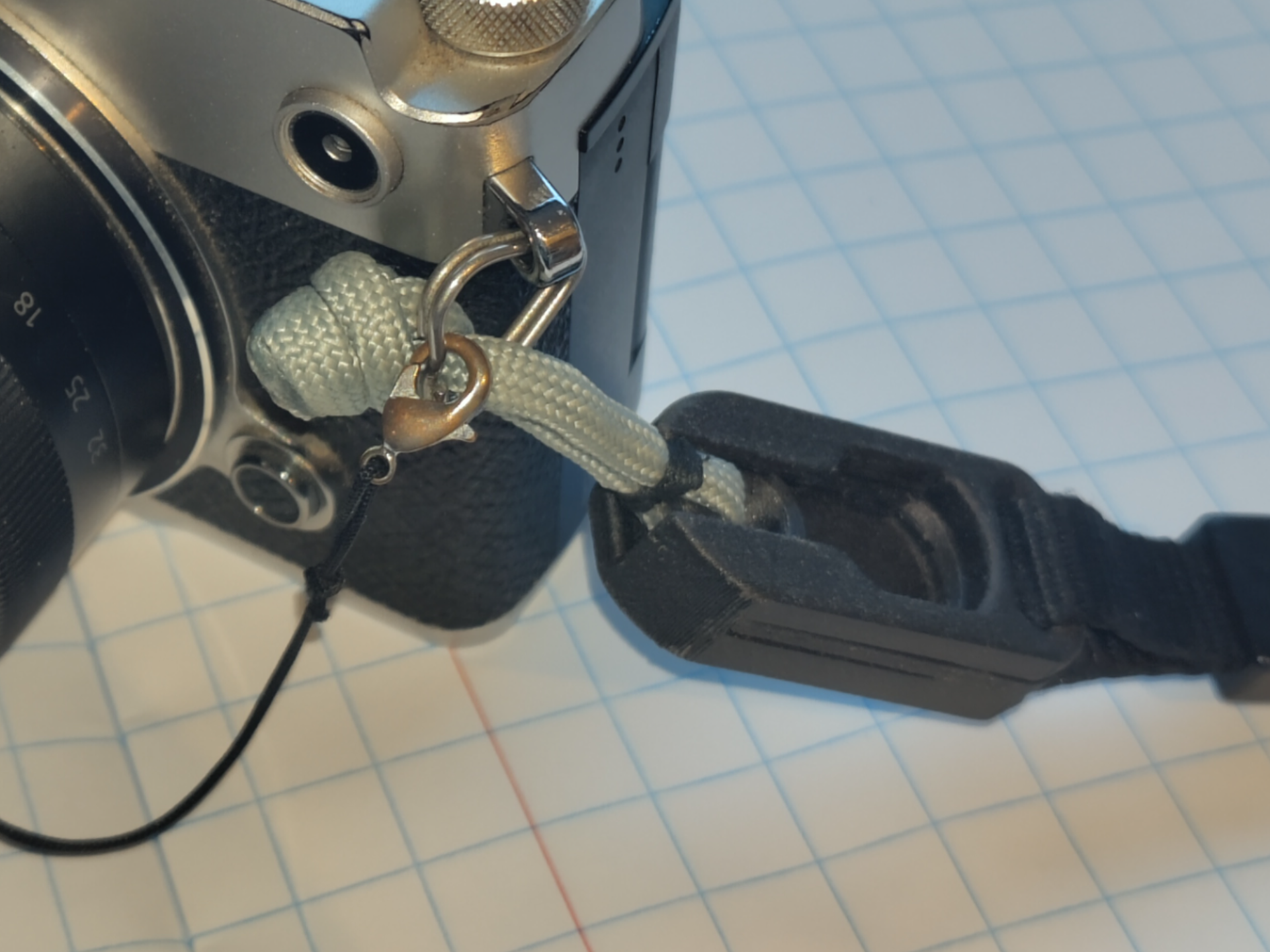Camera strap detachment System