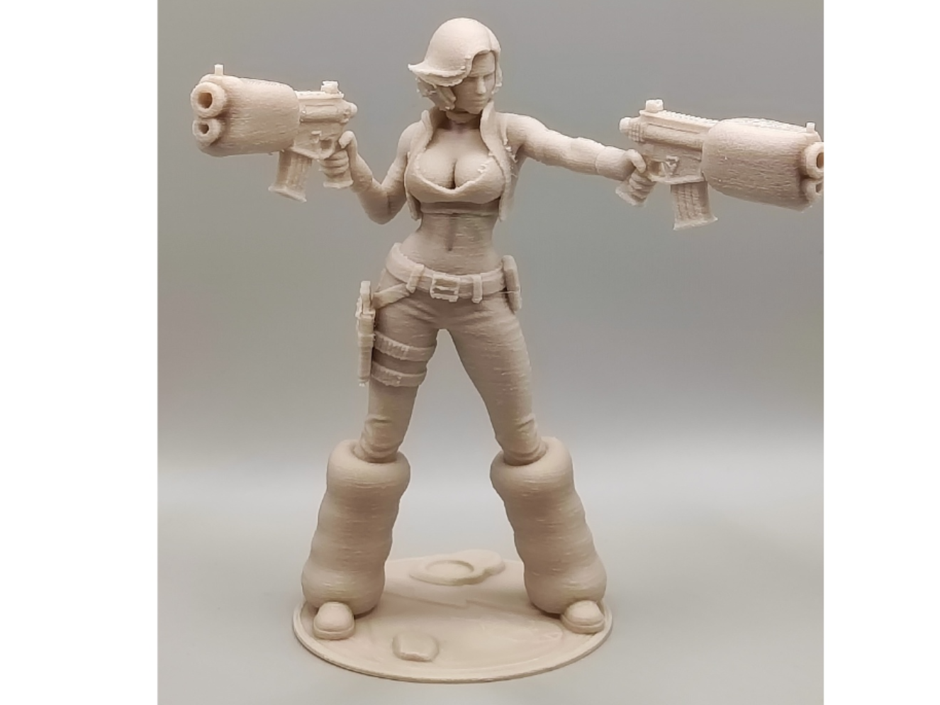 Action Girl with Two Guns figurine