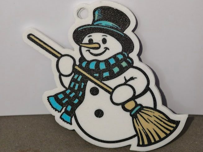 Snowman with a broom