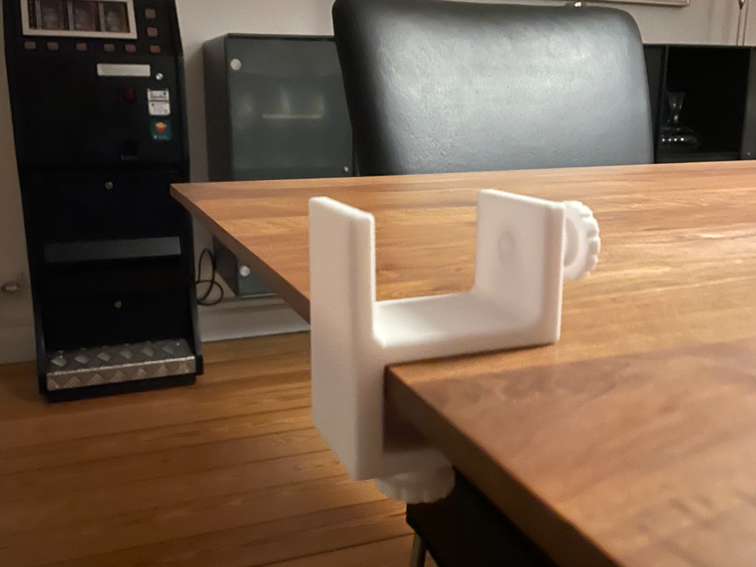 Power cord holder on table