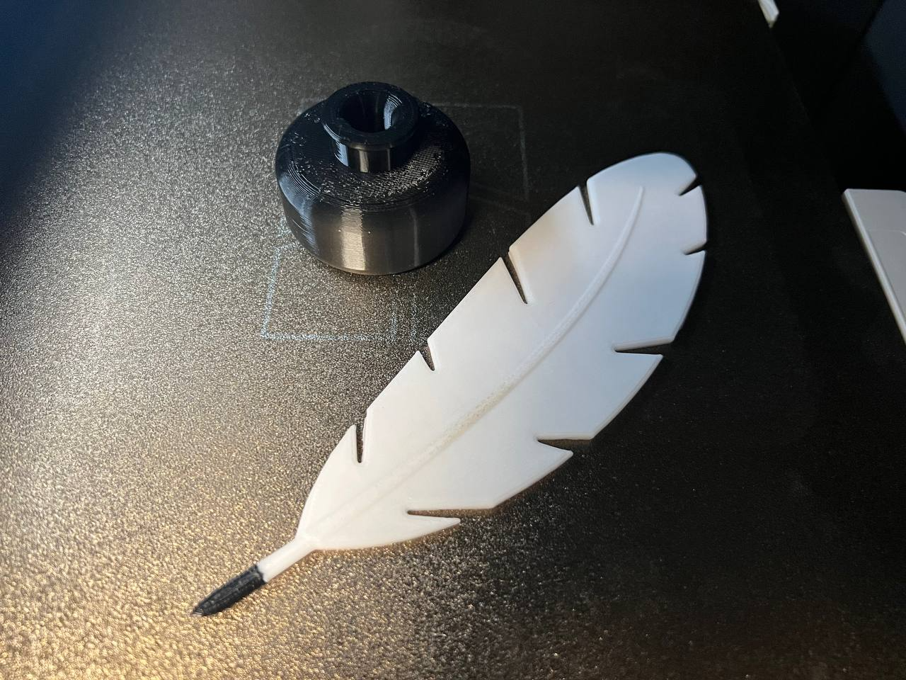 Feather and an ink bottle