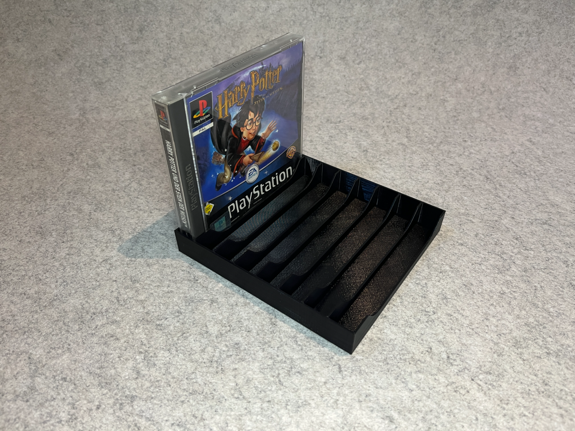 Games stand holder for PlayStation One (PSX, One)