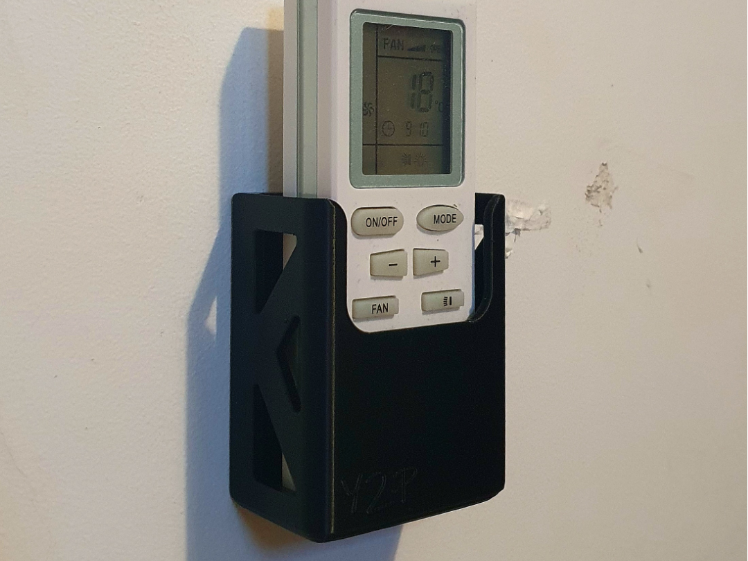 Universal remote wall holder/dock
