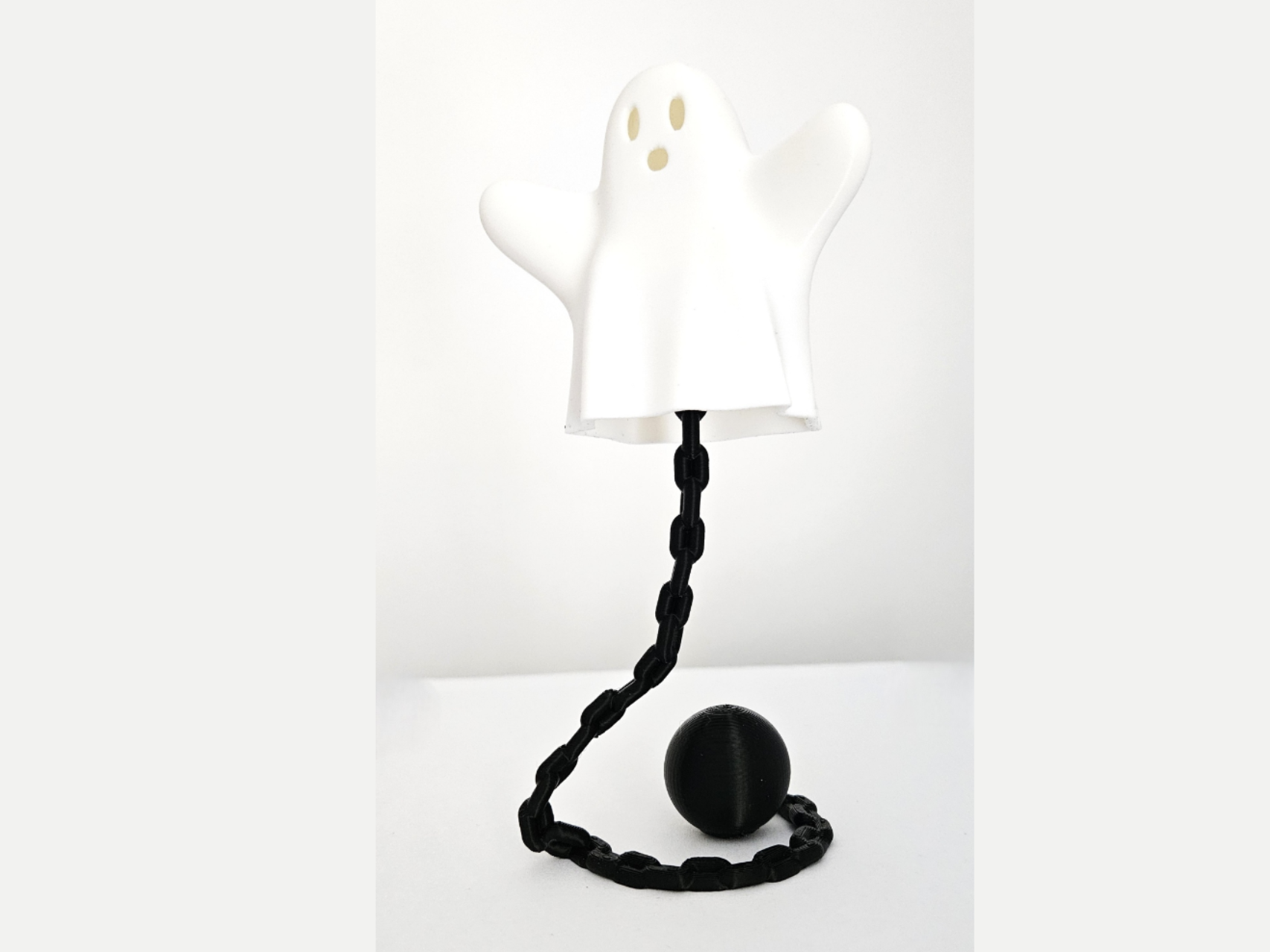 Flying ghost attached to its  chain and ball
