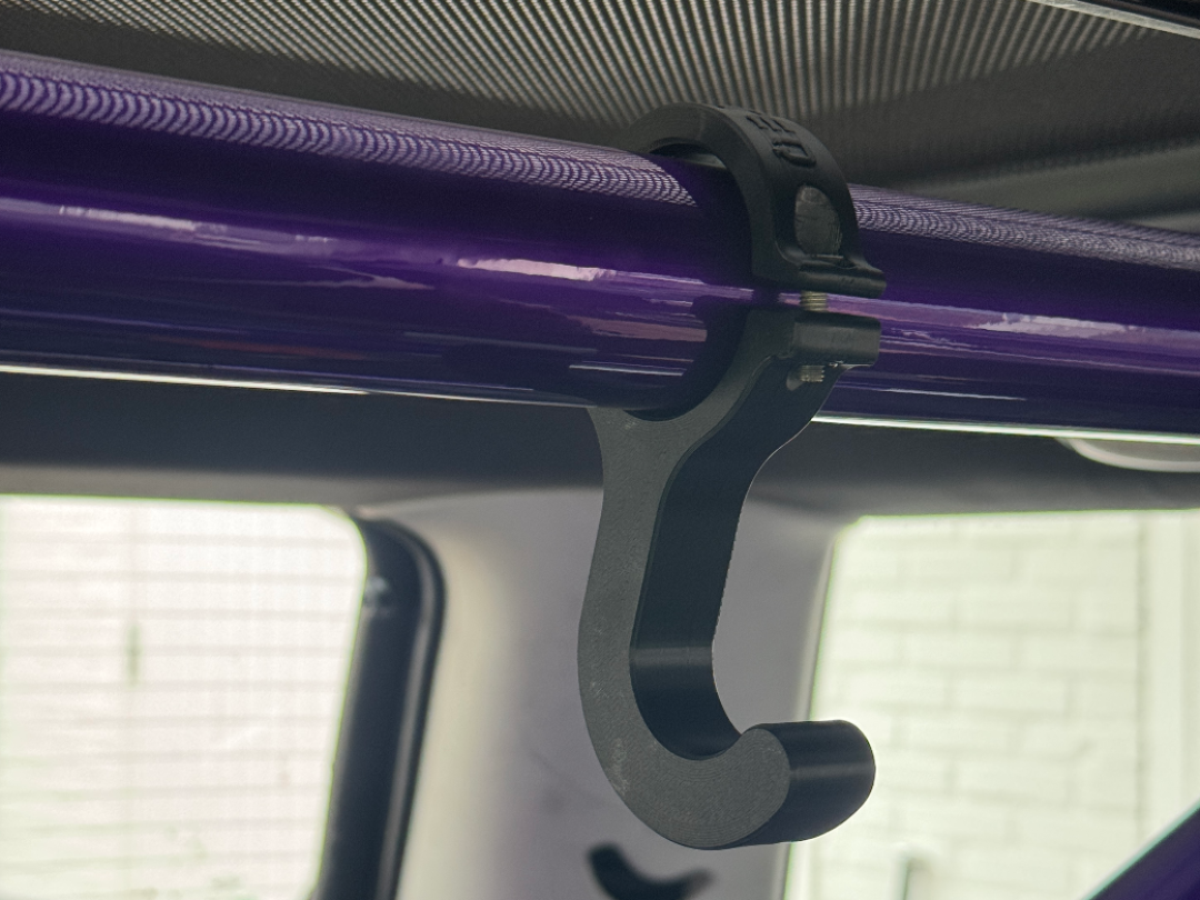 Roll cage steering wheel mount holder