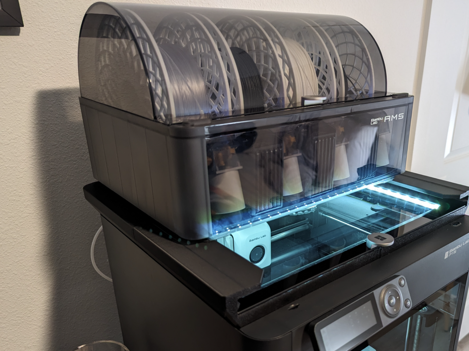 Low profile AMS riser with LED and glass lid riser