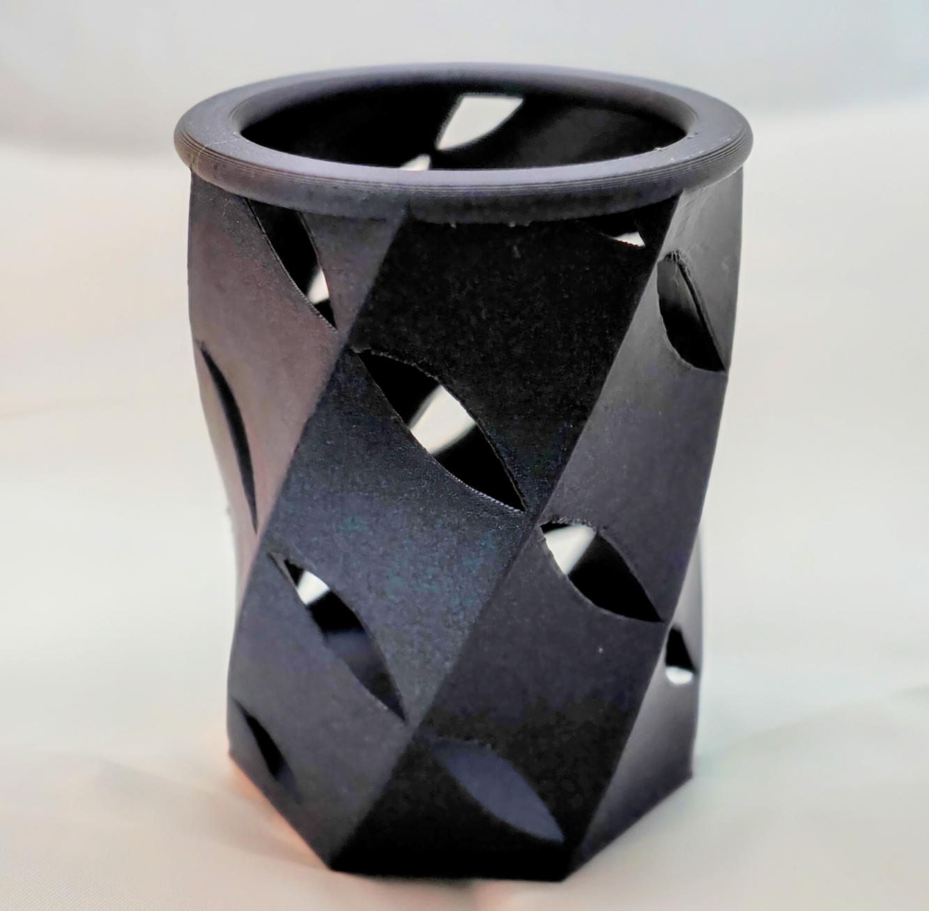 Leaky concentric helical pencil holder