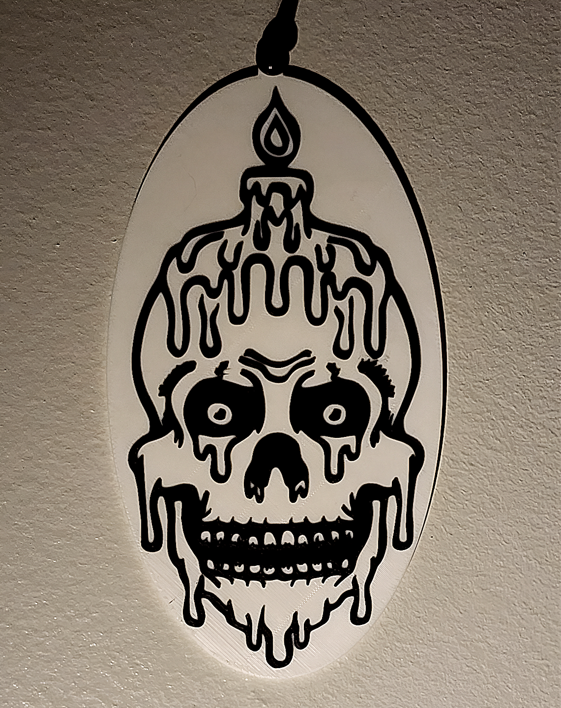 Melting Skull plaque with pinhole on top
