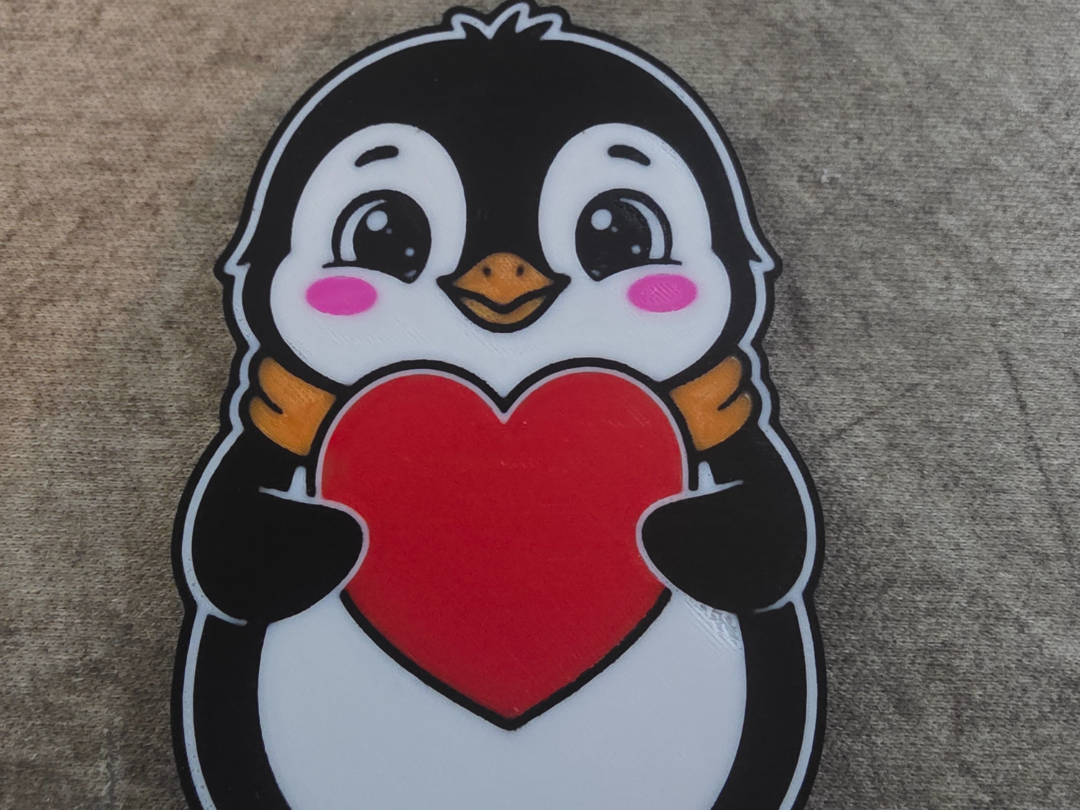 Porte clé Pingouin avec un cœur a la main