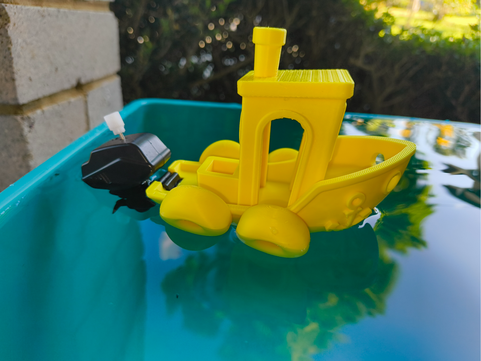 Floating Benchy with a windup motor and anchor