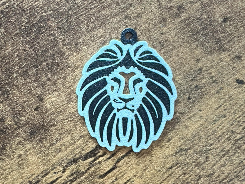 Lion face keychain art nouveau style