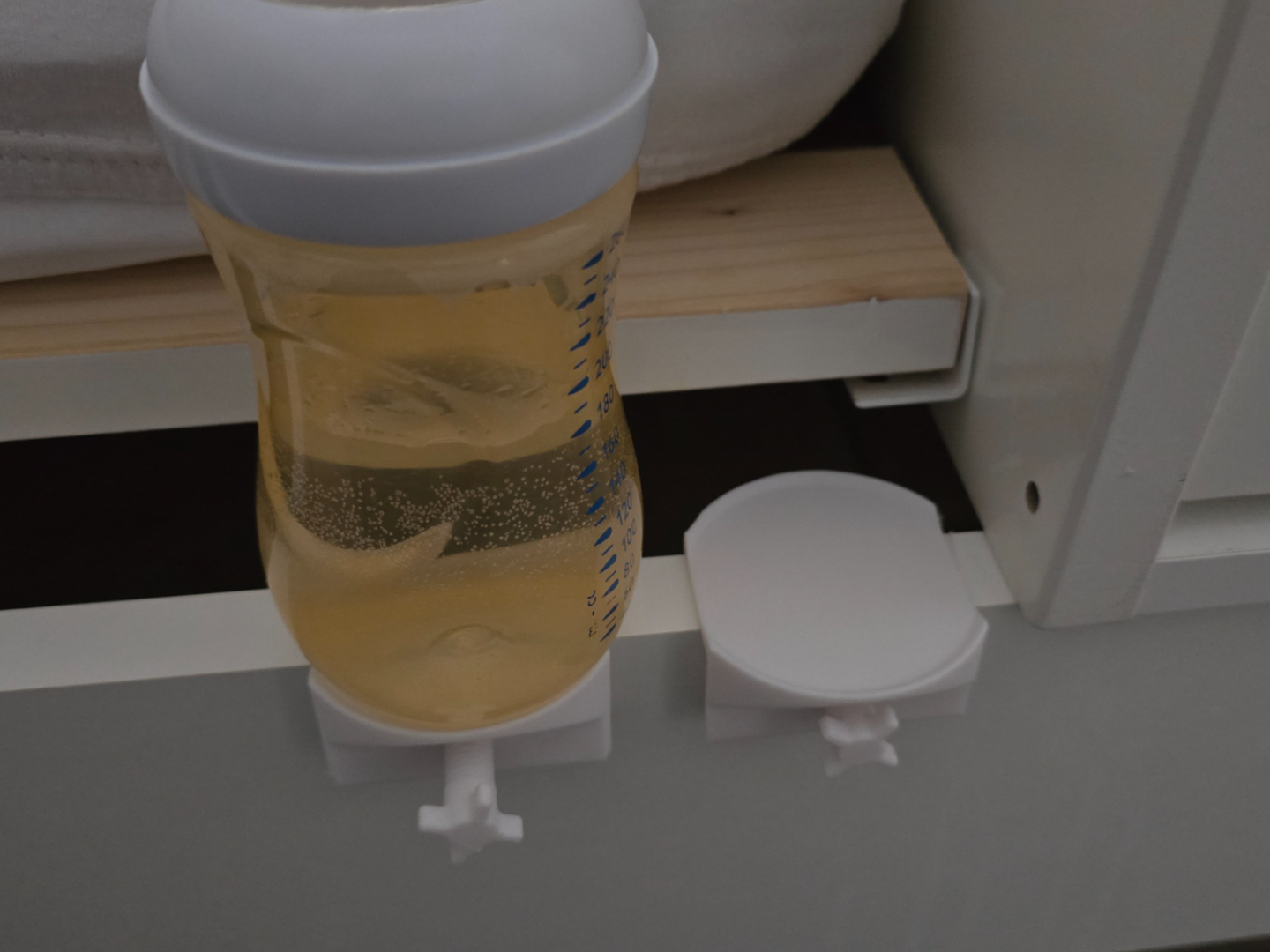 Baby bottle holder for bed