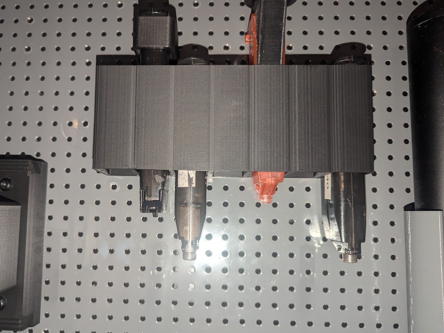 Airsoft pistol speedloader pegboard mount