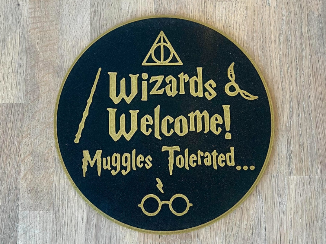Wizards Welcome Muggles Tolerated sign
