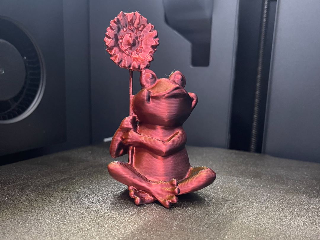 Frog with Sunflower sculpture