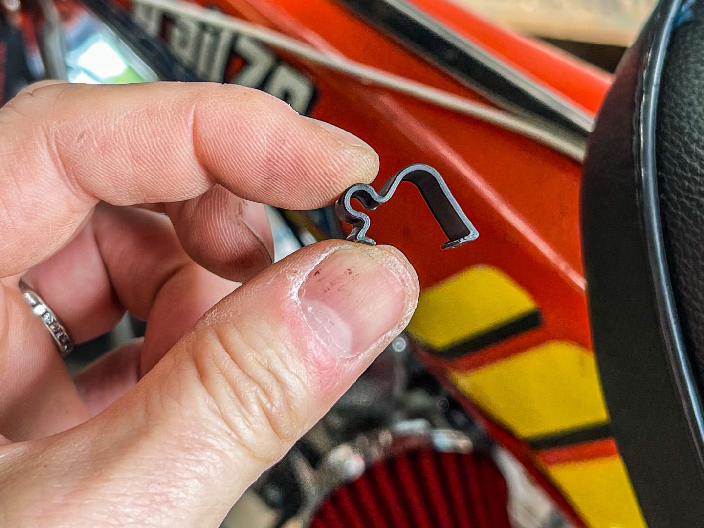 Honda CT70 phone charging cord keeper